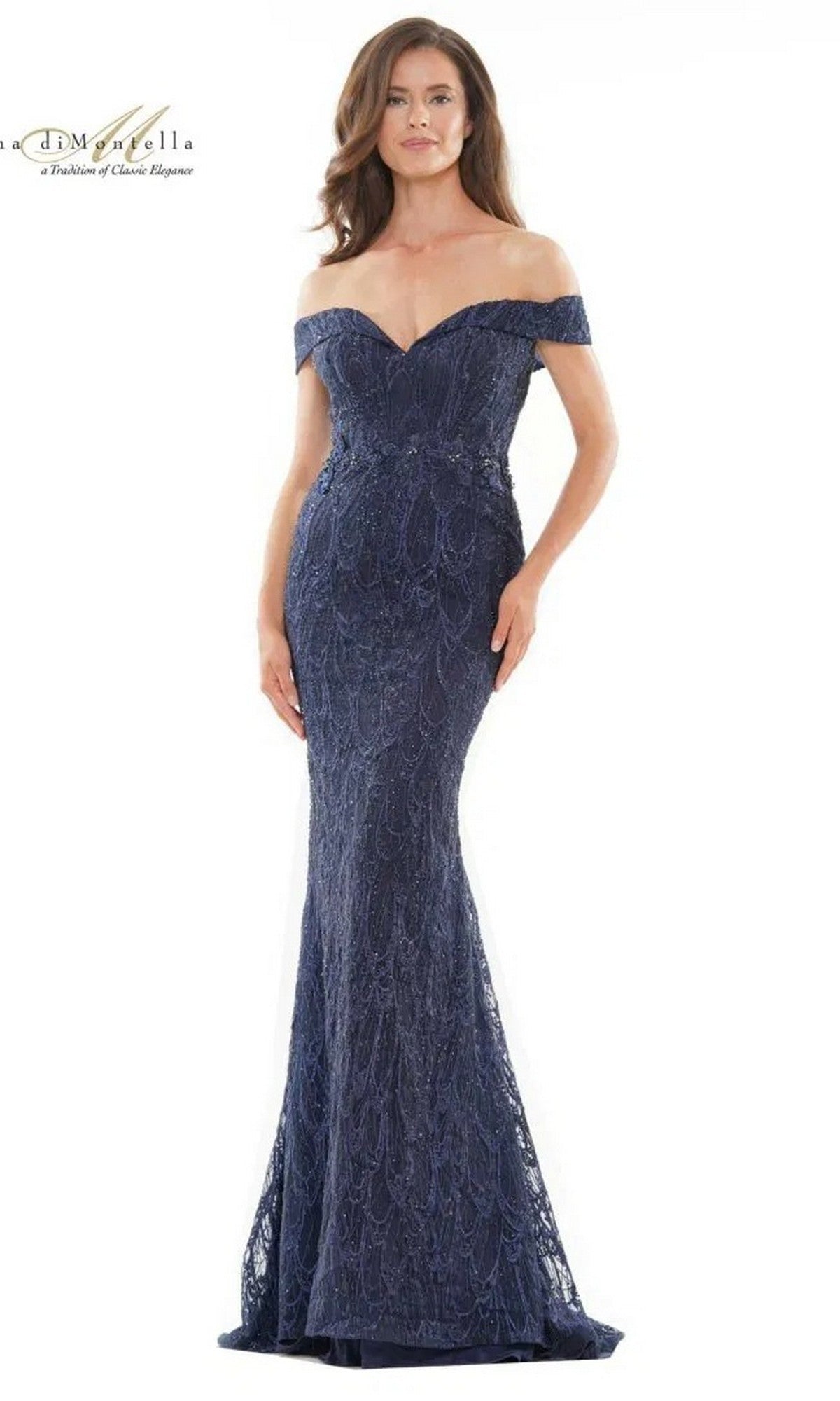 A woman poses gracefully against a white background in the navy Long Formal Dress Rina Di Montella RD2739, featuring off-the-shoulder styling with elegant lace and beaded embroidery.